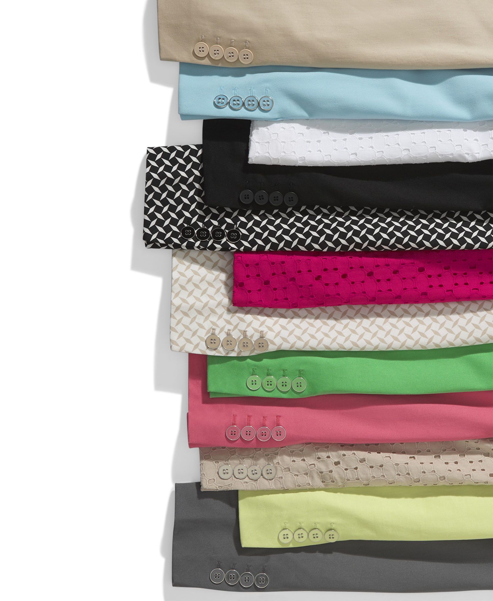 a marketing photograph of a color run of women's suit jacket cuffs on white