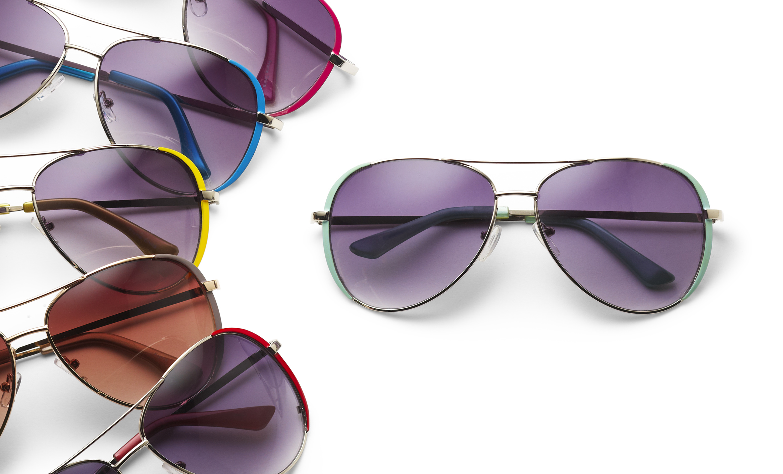 e-commerce group photograph of sunglasses with colorful frames.  five are fanned and one more by itself